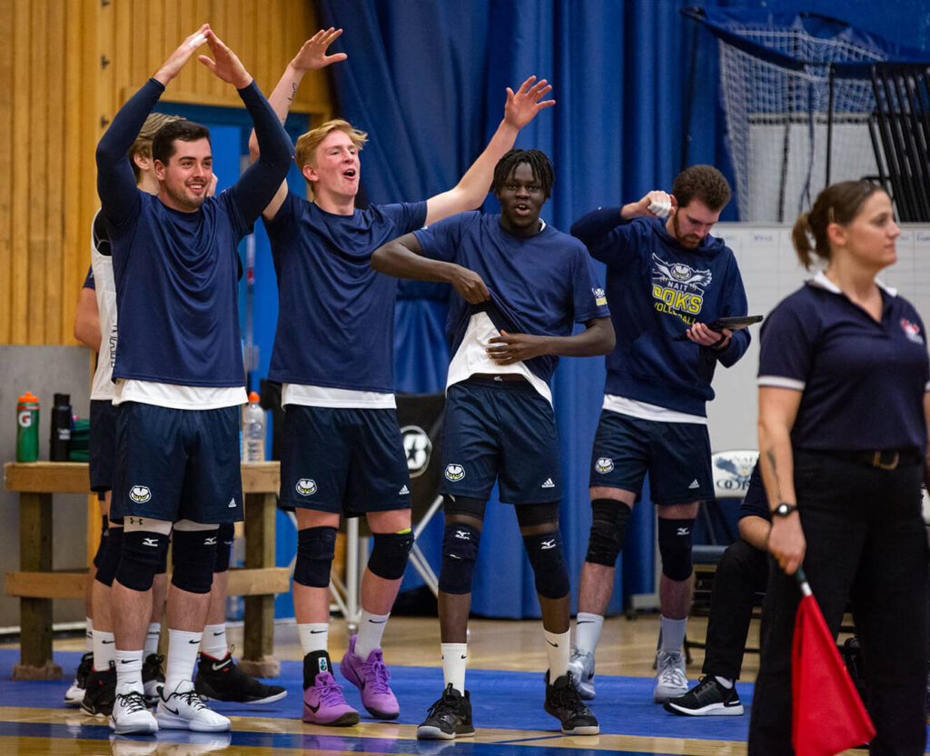 NAIT men's volleyball team celebrates when the team scores