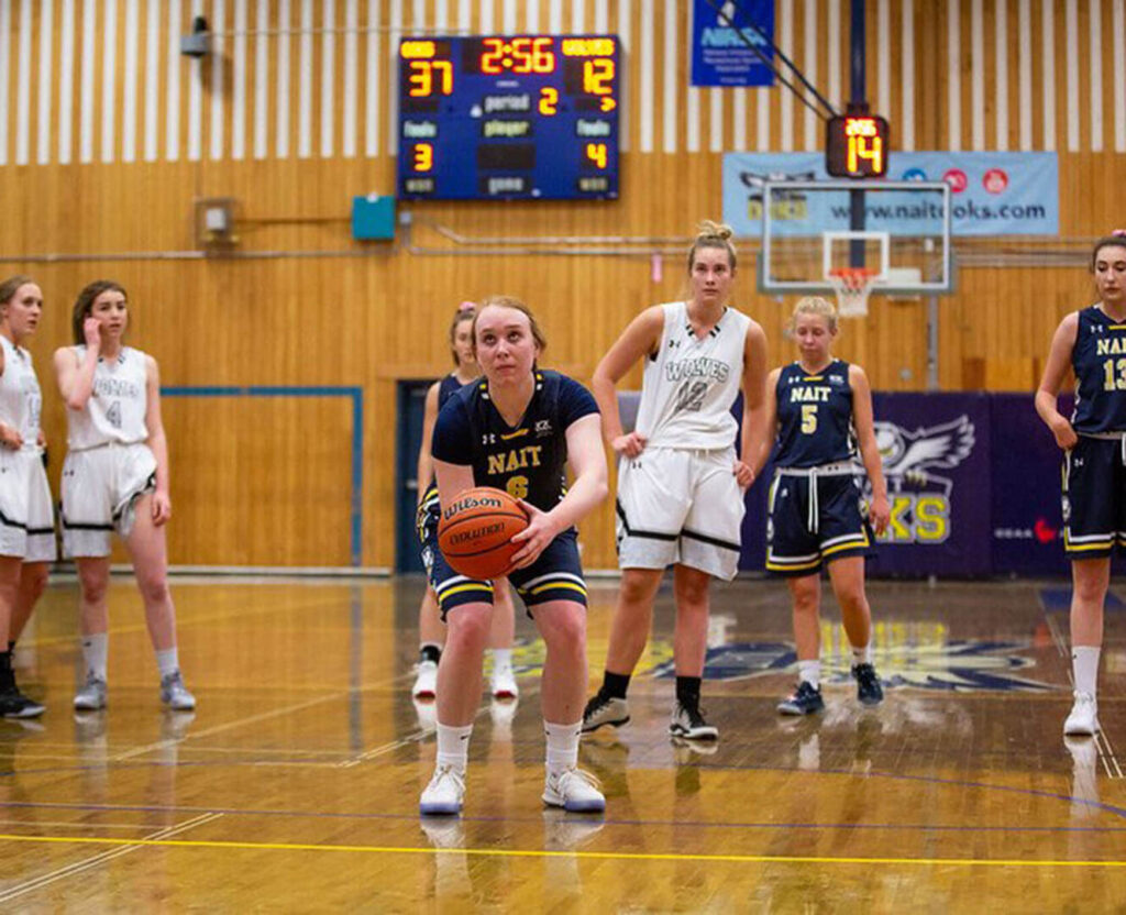 Carly McHarg nait women's basketball team