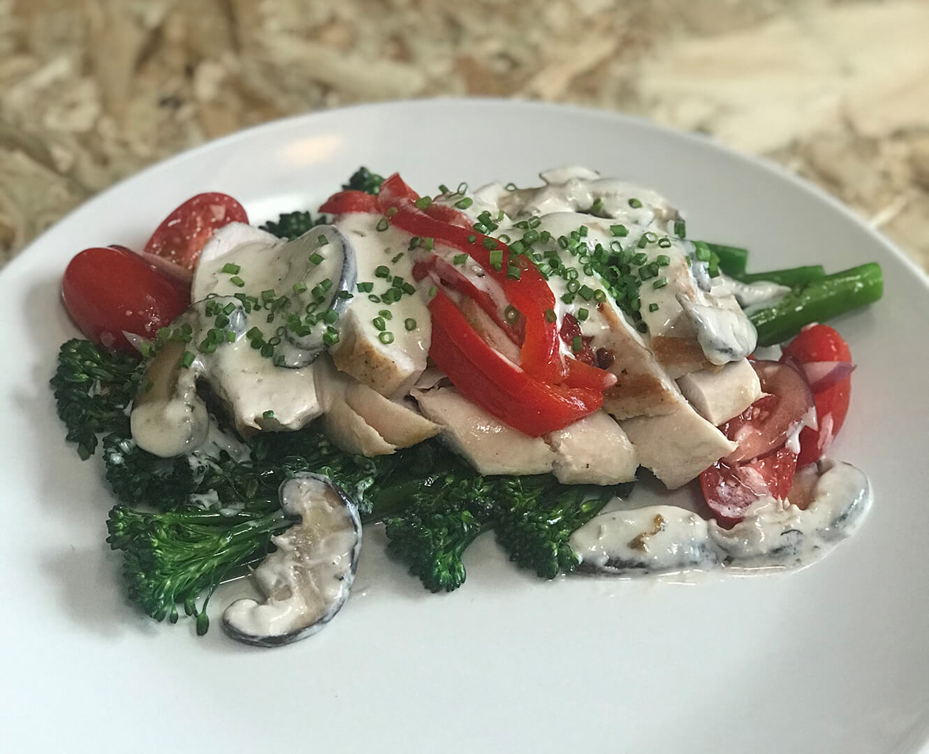 seared chicken with mushrooms broccoli and tomatoes