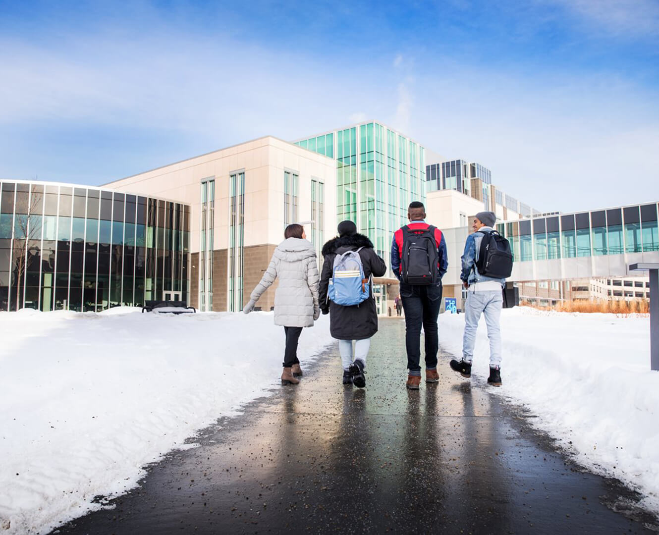 Students walk across NAIT campus