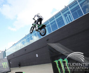 A person on a motorbike doing a jump