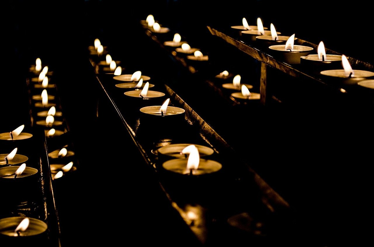 rows of lit candles