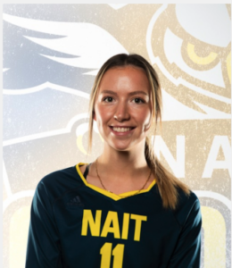 blonde girl wearing NAIT volleyball jersey