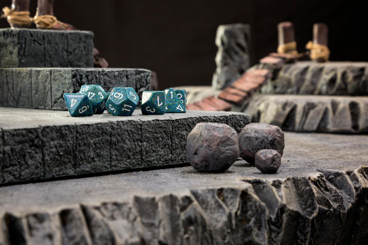 a bunch of dice sit on some stone steps