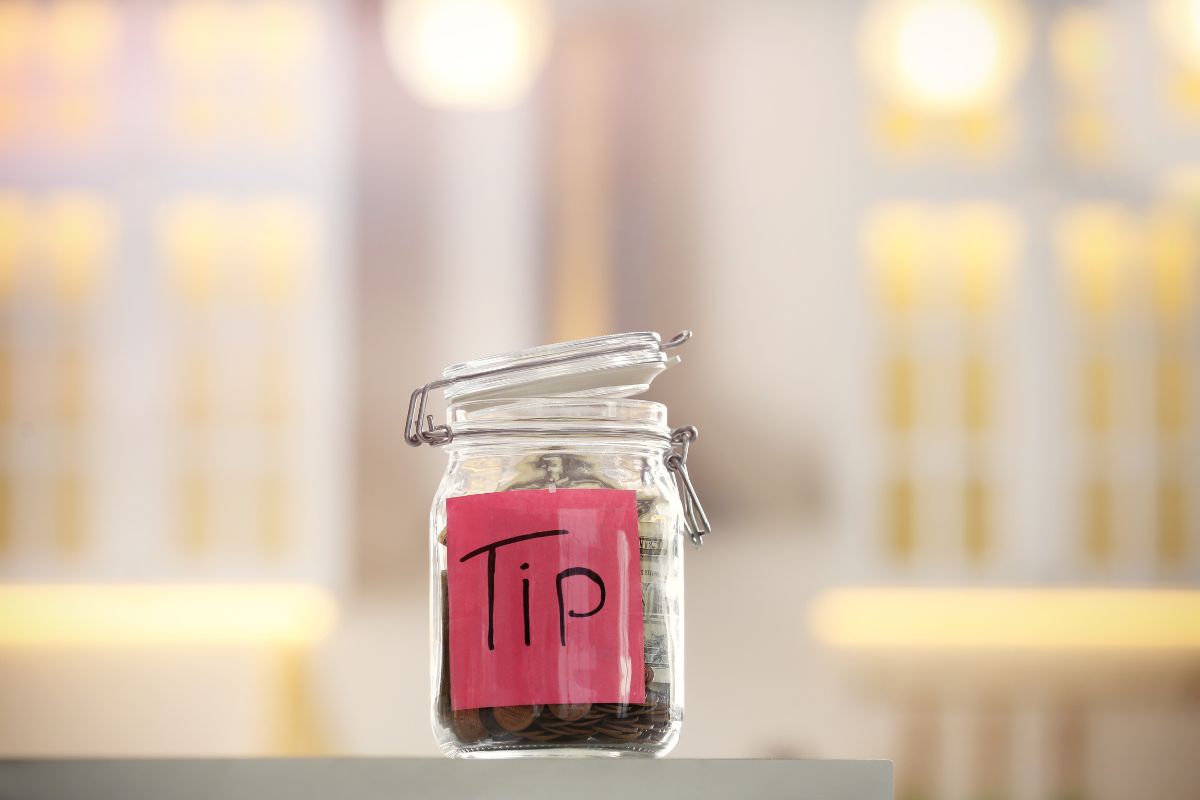 a glass jar with a red label that says "tips"