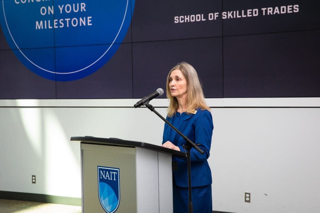 Laura Jo Gunter speaking at a NAIT Employee Milestone event in 2022.
