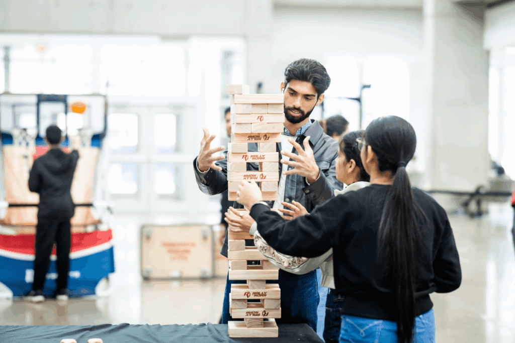 NAIT students play giant Jenga.